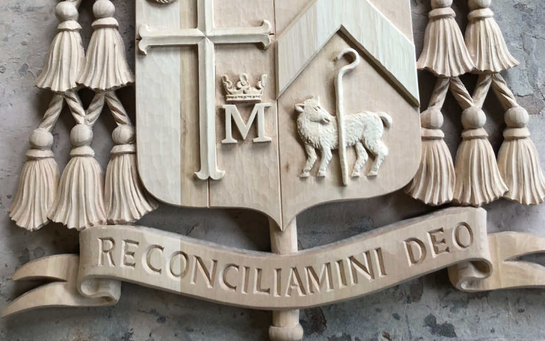 Custom carved coat of arms for Catholic bishop